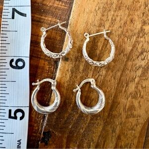 Two pair of small sterling silver hoops, one etched, one filigree